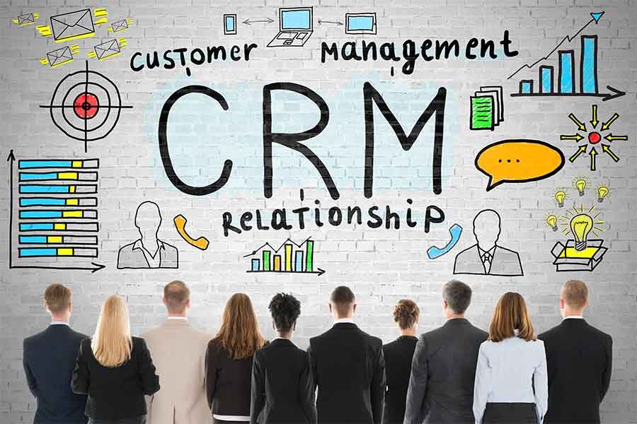 CRM concept with diverse businesspeople observing wall art.