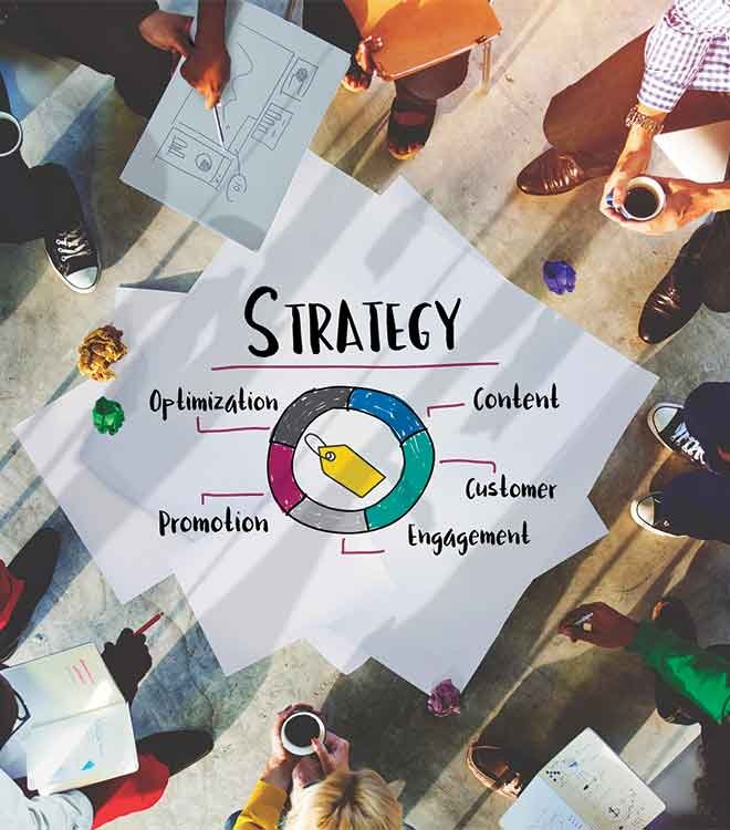 Team planning marketing strategy with diagram and coffee.