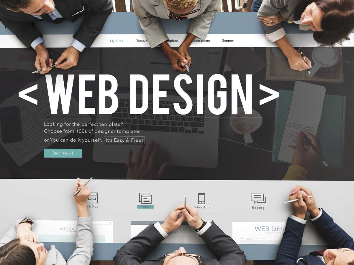 Web design meeting with templates and laptops.